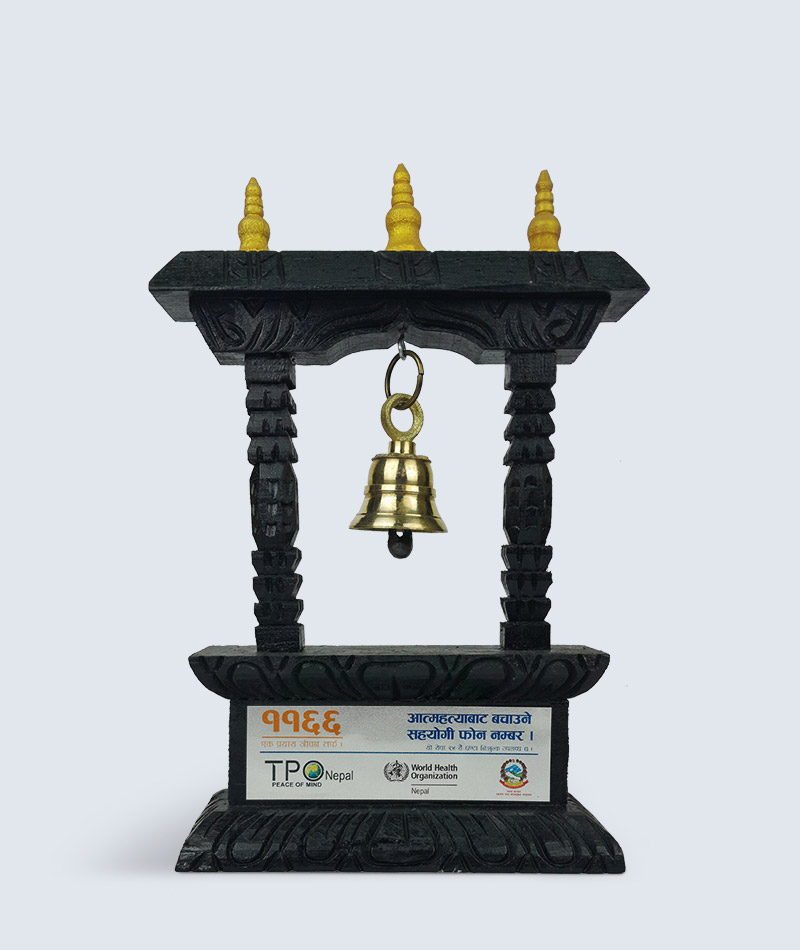 Brass bell in wooden shrine stand
