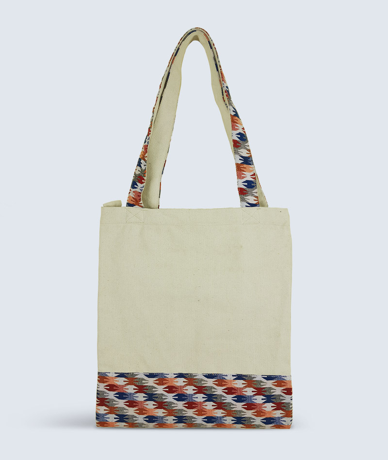 Canvas tote bag with Nepali Dhaka mix handle and zipper closure